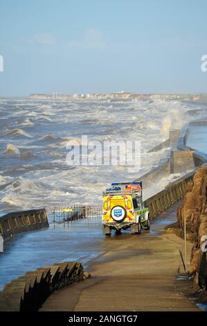 A Beach Patrol and Rescue vehicle on the lower walk at Blackpool as high tide and winds hit the coast Stock Photo