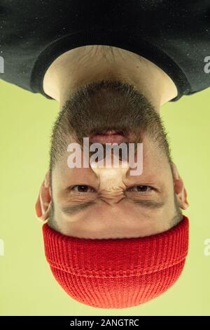 Half-length portrait of young scary girl isolated on red studio ...