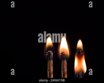 burning matches on black background Stock Photo