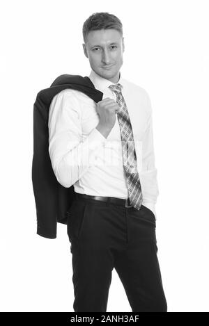 Handsome Caucasian businessman with jacket over shoulder Stock Photo