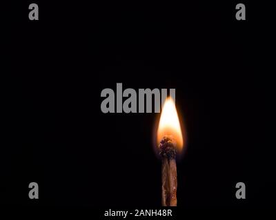 burning match on black background Stock Photo
