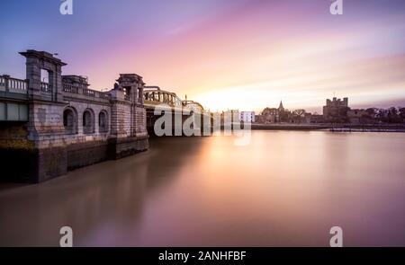 Rochester Bridge over the River Medway looking towards Rochester Cathedral at dawn. Stock Photo