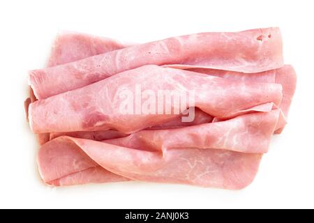 Shaved folded slices oh ham isolated on white from above. Stock Photo