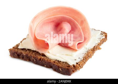 Single folded slice of ham sausage on rye bread with cream cheese spread isolated on white. Stock Photo