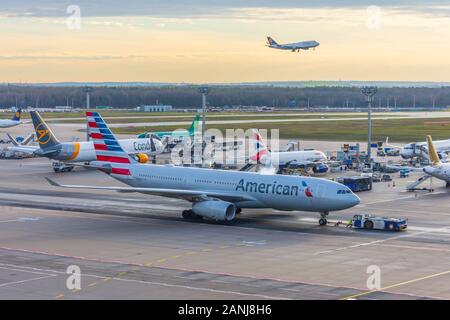 Airbus A330 American Airlines in airport push back tow. Frankfurt, Germany 17 December 2019 Stock Photo