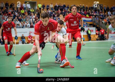 Berlin, Germany. 17th Jan, 2020. Hockey, Men: European Championship, Germany - Belgium, preliminary round, Group B, 1st matchday. Belgium's Tom Degroote defends the ball against Germany's Jan Schiffer. Credit: Gregor Fischer/dpa/Alamy Live News Stock Photo