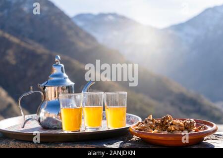 Famous Moroccan mint tea and silver kettle in High Atlas mountains, Aroumd Stock Photo