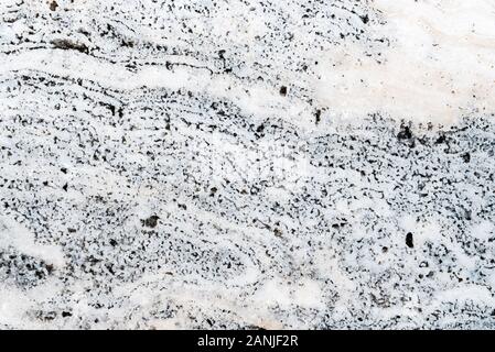 Smooth surface texture of stone, White and black color striped wave pattern of marble, Strong structure durable nature of rock for abstract background Stock Photo