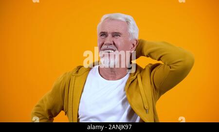 Confused senior man scratching head, thinking about answer lack of ideas concept Stock Photo