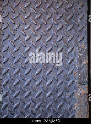 Old Detailed Aged Vintage Seamless anti slip textured metal sheet plate, diamond pattern safety floor footing in construction industry. Background, Ba Stock Photo