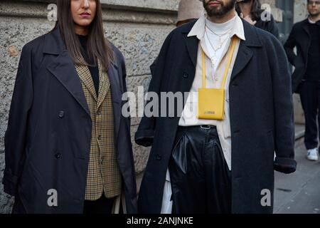 MILAN, ITALY - JANUARY 13, 2019: Man with Louis Vuitton bag and green scarf  before Reshake fashion show, Milan Fashion Week street style Stock Photo -  Alamy