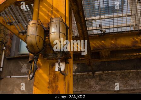 Two Old Bulkhead Lamps On A Steel Beam Rusty Lamps With Grille Protection Vintage Industrial Look Lamp Industry Warm Red Shadows Stock Photo Alamy