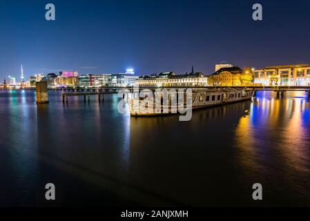 Old big boat that ran aground, an old boat lies on the ground, night shot, colorful, Berlin, Treptow harbor Stock Photo