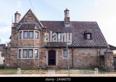 The gate house at the entrance to the Homewood Cemetery on Dallas Avenue on a sunny winter day, Pittsburgh, Pennsylvania, USA Stock Photo