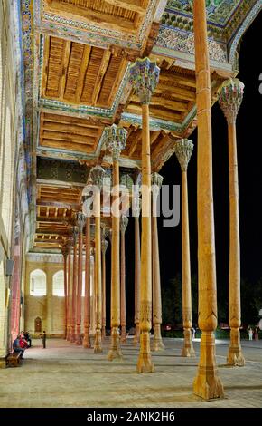 night shot of illuminated Columns of Bolo Hovuz Mosque or Bolo Hauz mosque, Bukhara, Uzbekistan, Central Asia Stock Photo
