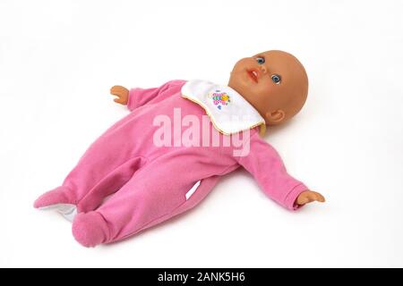 Fisher-Price Soft Body Baby Doll wearing a Babygro and Bib Stock Photo