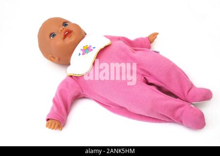 Fisher-Price Soft Body Baby Doll wearing a Babygro and Bib Stock Photo