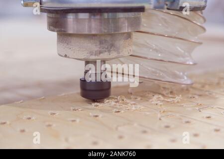 Processing of panels on the coordinate-milling woodworking machine with CNC. Stock Photo