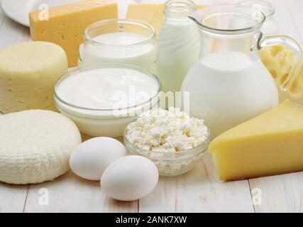 Close up of different dairy products on white wooden background Stock Photo