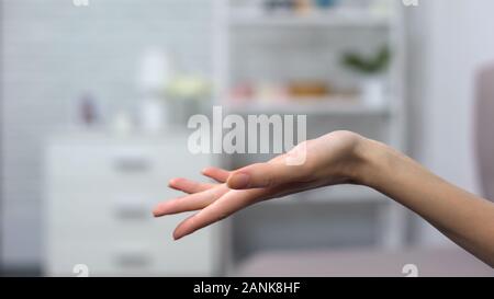 Lady giving helping hand asking or offering help, support in difficult situation Stock Photo