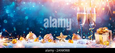 New Year Toast Champagne Flutes With Christmas Decoration Stock Photo