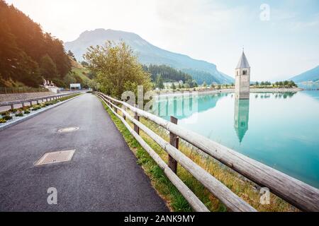 The old bell tower of Curon Venosta church rising out of the waters lake of Resia, Graun im Vinschgau village, Trentino-Alto Adige region of Italy, Eu Stock Photo