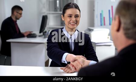 Company CEO shaking hand with candidate, good interview result, hiring concept Stock Photo