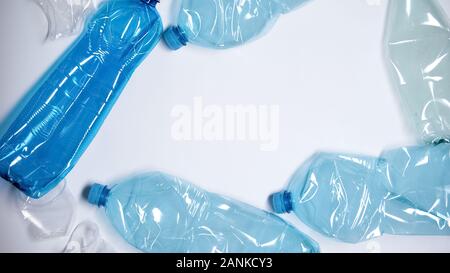 Plastic bottles lying on white background, place for text template, pollution Stock Photo