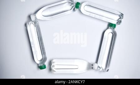 Plastic water bottles lying on background, environmental pollution, draught Stock Photo