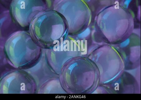 Colorful purple glass balls close up view background Stock Photo