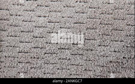 Perforated gray fluffy fabric background close up view Stock Photo