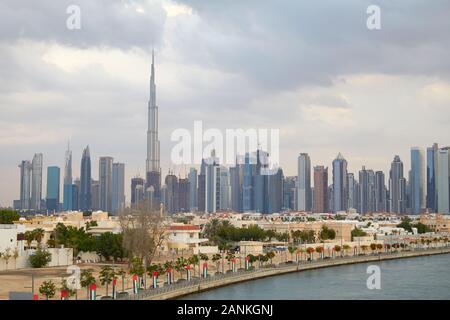 Dubai city skyline with Burj Khalifa skyscraper and residential buildings in a cloudy day Stock Photo