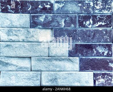 Stone wall, multicolored sandstone in the form of a tile, background or texture. Stock Photo