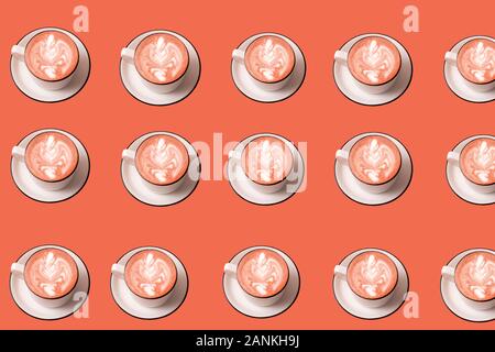 Seamless pattern with Latte art coffee in cups on living coral color background. Stock Photo
