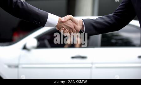 Politicians shaking hand, agent taking secret photo on background, black market Stock Photo