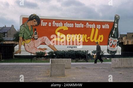 !950s era billboard for 7Up soda with teenager in the London, England uban landscape. Stock Photo