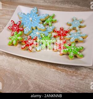 Close side view of mini snowflake sugar cookies for winter or christmas Stock Photo