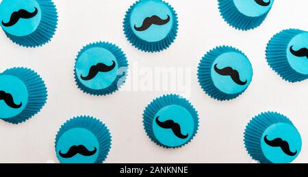 Blue mustache cupcake papers themed for fathers day, a baby shower, or kids birthday party. Stock Photo