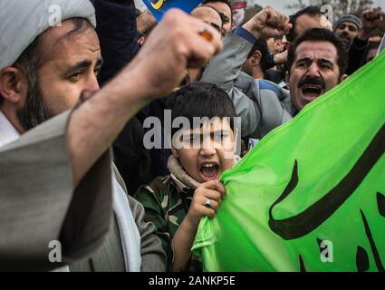 Tehran, Iran. 17th Jan, 2020. Supporters of Iran's Supreme Leader Ayatollah Ali Khamenei shout slogans during a protest after the Friday prayer in Tehran, Iran, on Jan. 17, 2020. Ayatollah Ali Khamenei on Friday said that the U.S. assassination of Iran's Quds commander Qassem Soleimani was a 'cowardice act' which hurts the U.S. superpower prestige. Credit: Ahmad Halabisaz/Xinhua/Alamy Live News Stock Photo