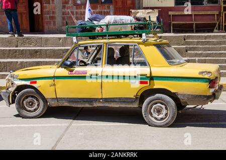 An old car in Lares, Peru, the starting point of the famous Lares Trek to Macchu Picchu Stock Photo