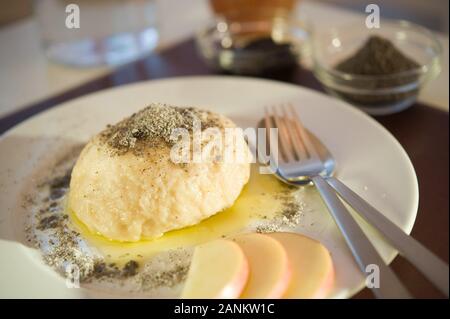 Germknödel mit Butter und Mohn - Steamed Sweet Austrian Dumplings Stock Photo