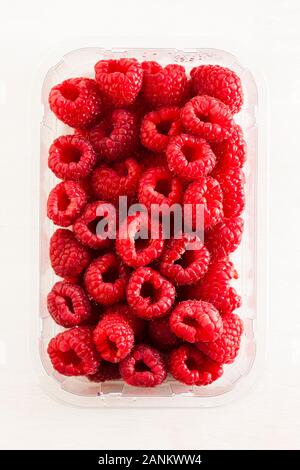 Overhead view of fresh raspberries on a heart shaped plate Stock Photo ...