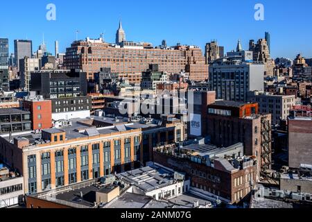 New York, USA, 17 January 2020.  The Empire State Building towers over Lower Manhattan rooftops in a clear Winter day.  Credit: Enrique Shore/Alamy St Stock Photo