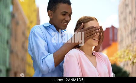 Couple standing face to face with their eyes closed. Boyfriend and  girlfriend imagine their future together.