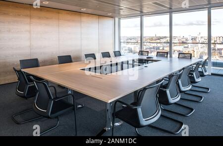 Boardroom overlooking city Stock Photo