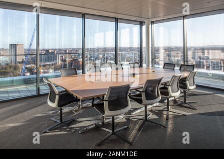 Boardroom overlooking city Stock Photo