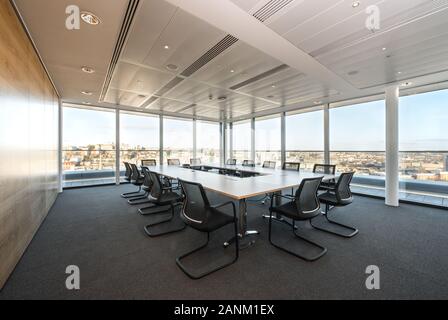 Boardroom overlooking city Stock Photo