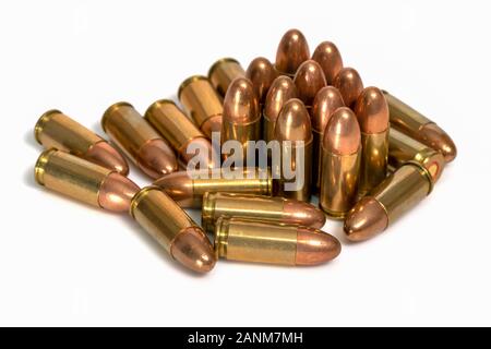 Pile of 9mm bullets on a white background. Image Stock Photo