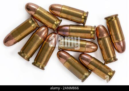 Pile of 9mm bullets on a white background. Image Stock Photo