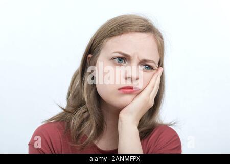 Young caucasian woman girl with sad, upset thoughtful expression, thinking What to do Stock Photo